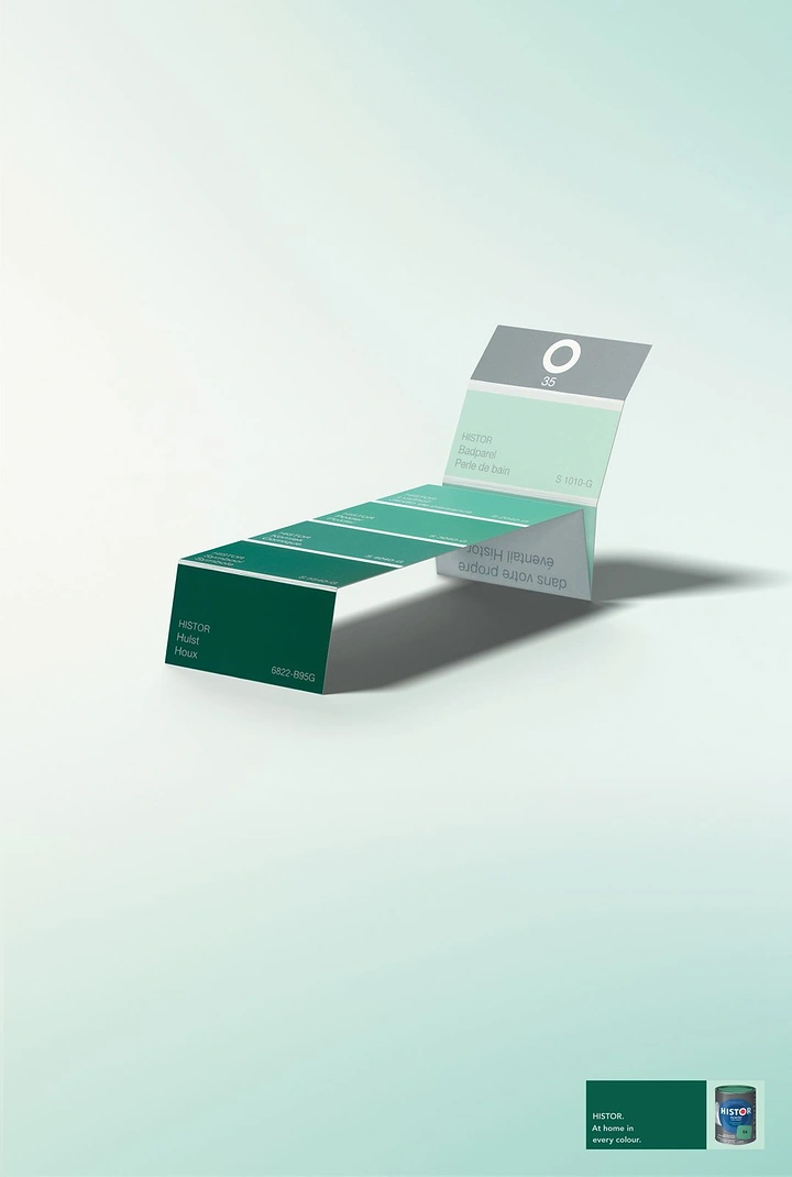 Home Decor creative ad: Green paint swatch strip folded into a sun lounger
