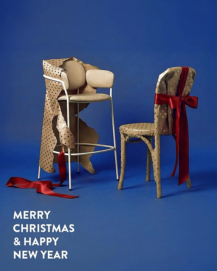 Christmas creative ad: Two chairs wrapped in kraft gift paper with red ribbons