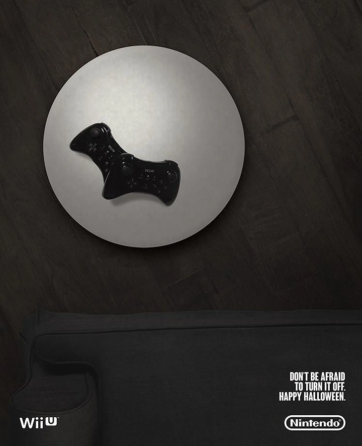 Gaming & Esports creative ad: Wii remote shadow forms bat, Halloween
