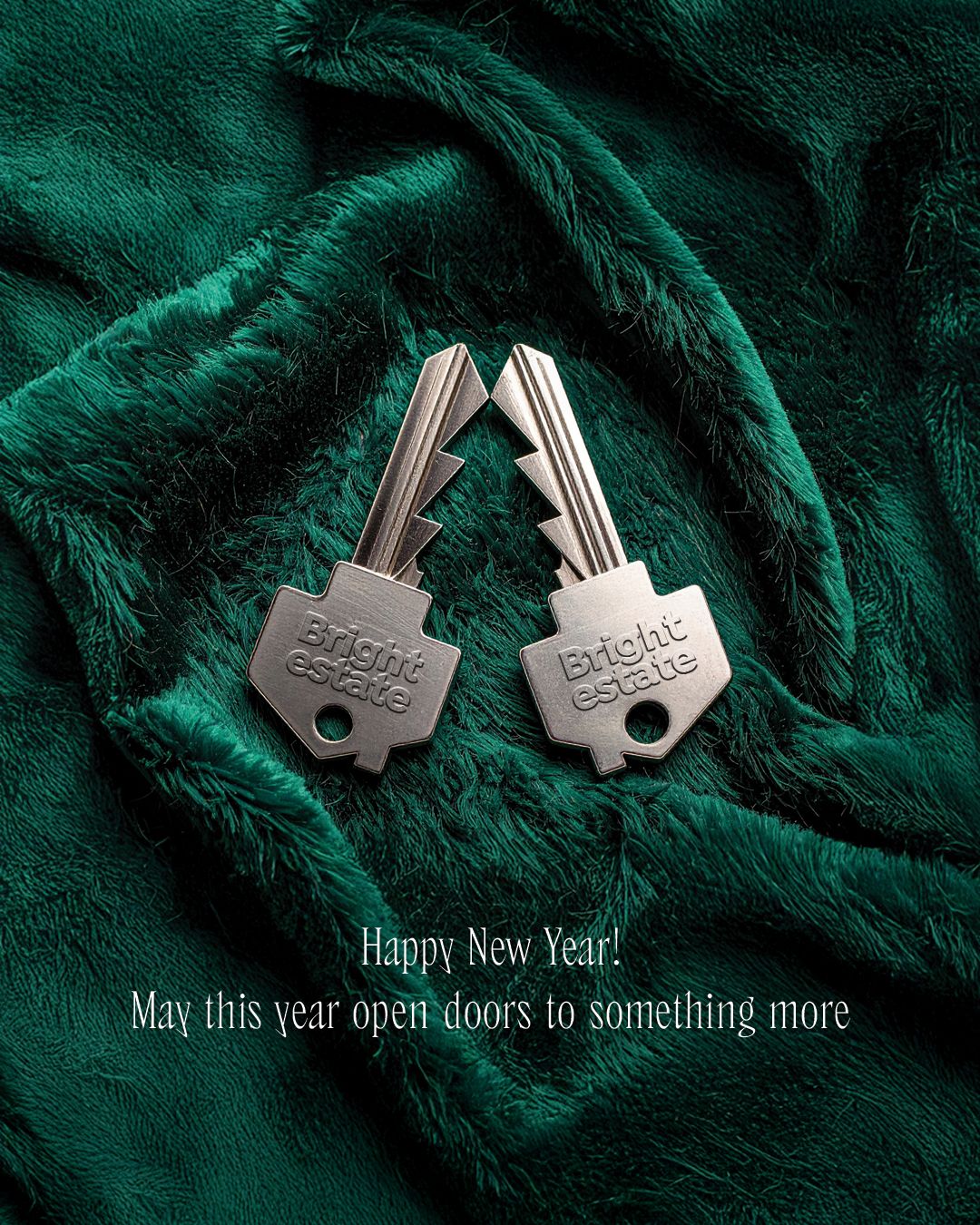 New Year Instagram post: Two branded silver keys forming a Christmas-tree silhouette