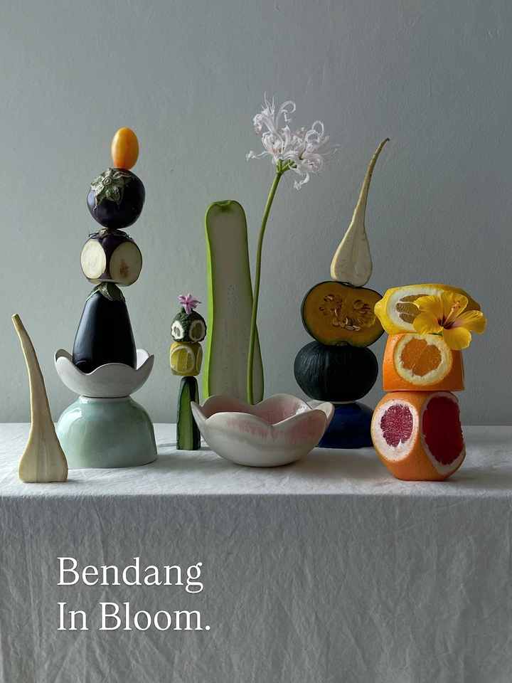 Home Decor creative ad: An art-directed still life of fruit, flowers, and sculptural ceramic objects