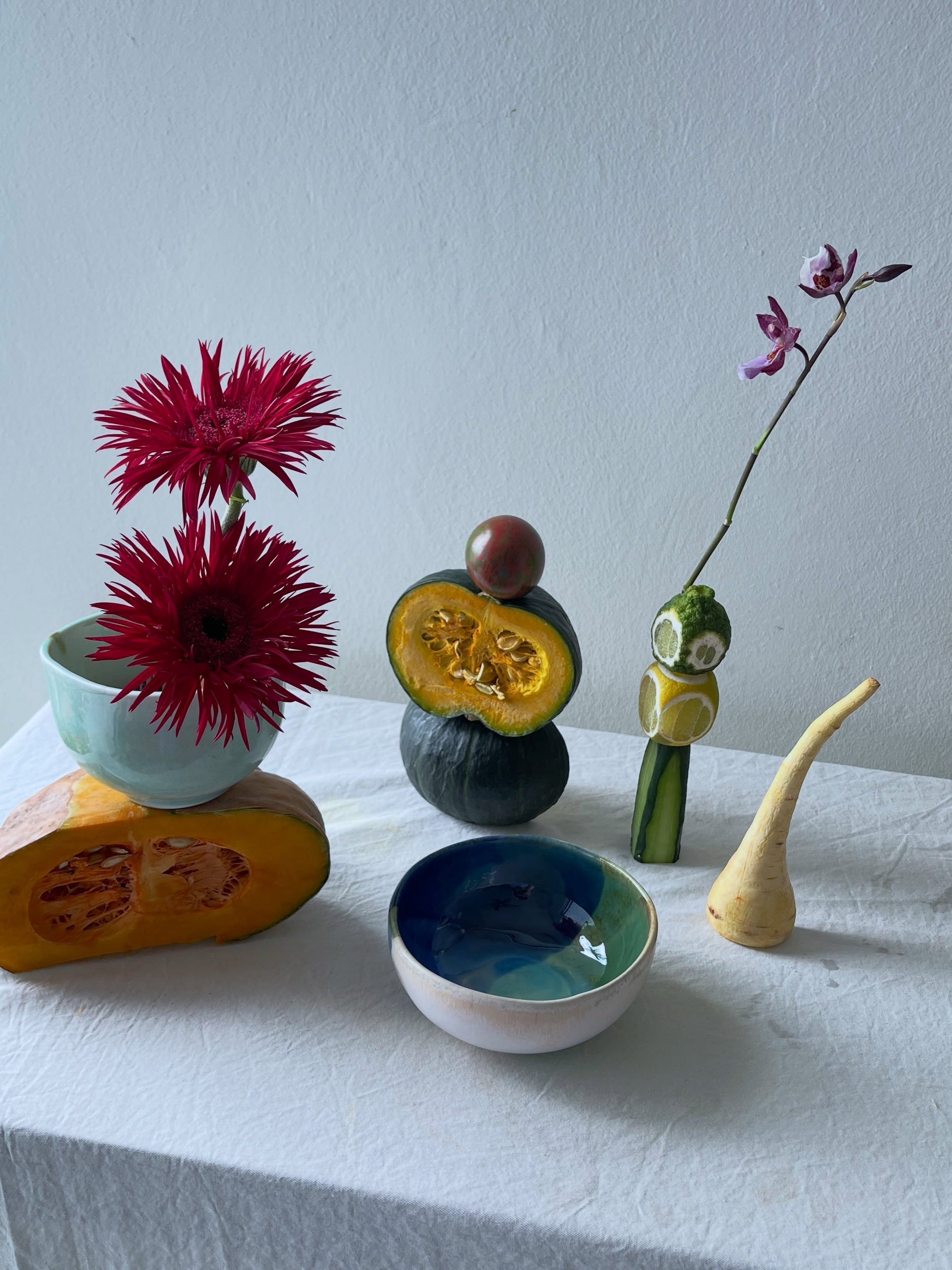 Carousel: An art-directed still life of fruit, flowers, and sculptural ceramic objects, slide 6