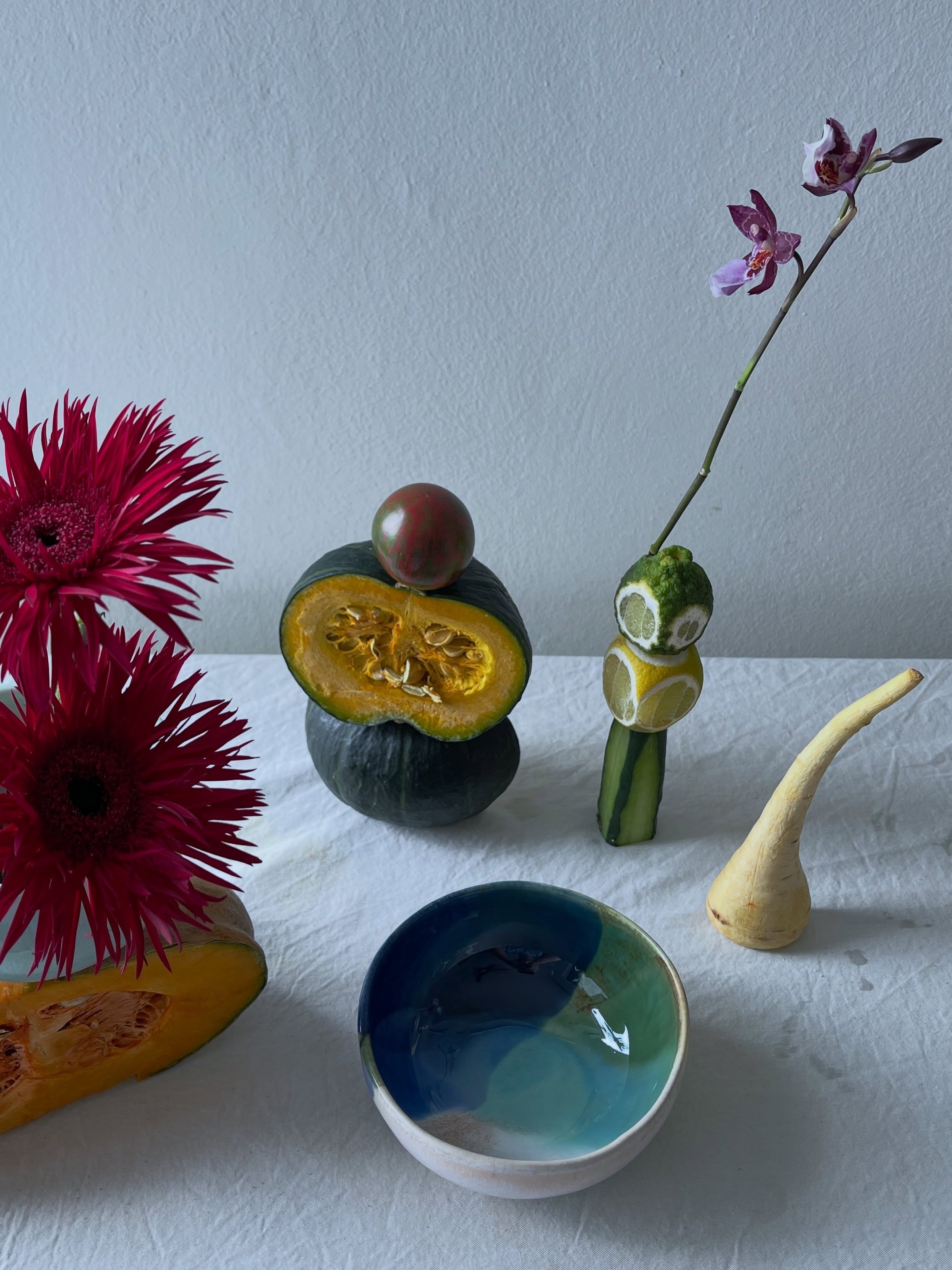 Carousel: An art-directed still life of fruit, flowers, and sculptural ceramic objects, slide 9