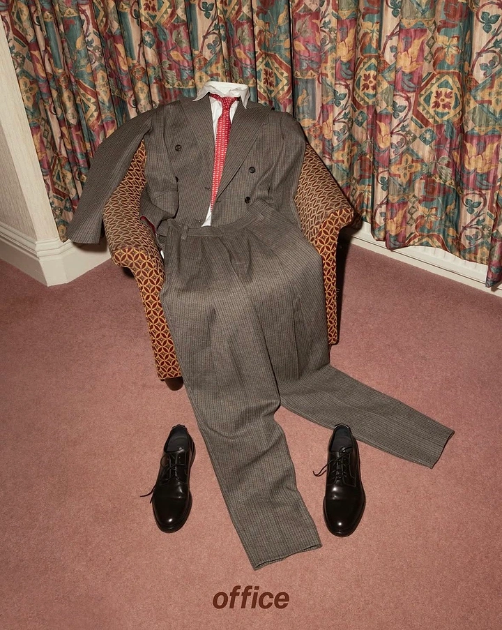 Men's Suits & Formal Wear creative ad: Suit occupies chair like a person