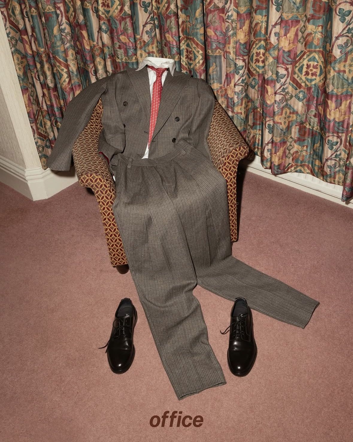 Instagram post: Suit occupies chair like a person