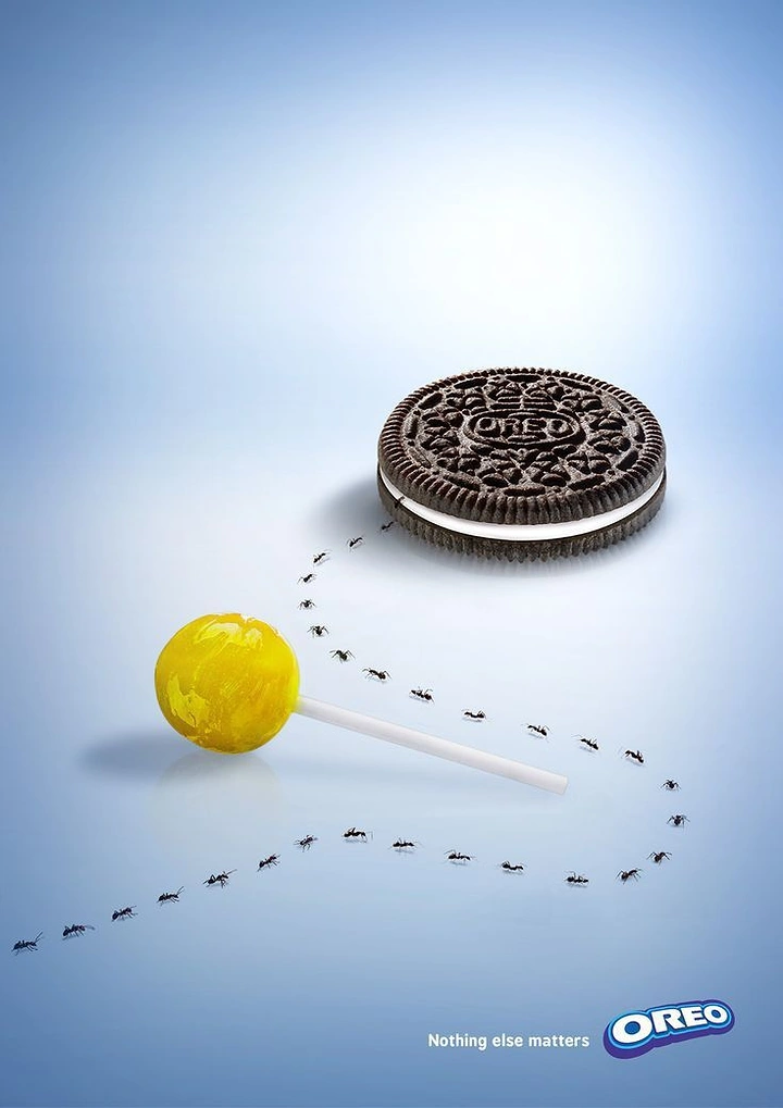 Sweet Shop creative ad: Ant trail bypassing a lollipop to reach a cookie