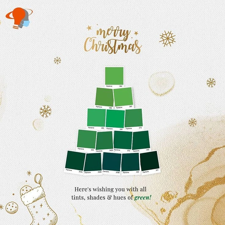 Christmas creative ad: Christmas tree built from green Pantone colour swatch cards