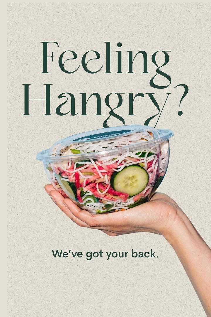 Organic & Farm Produce creative ad: Outstretched hand holding a clear takeaway bowl of noodle salad