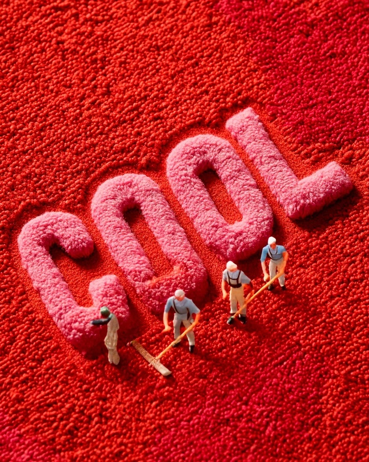 Rugs & Carpets creative ad: Tiny workers shape oversized carpet lettering