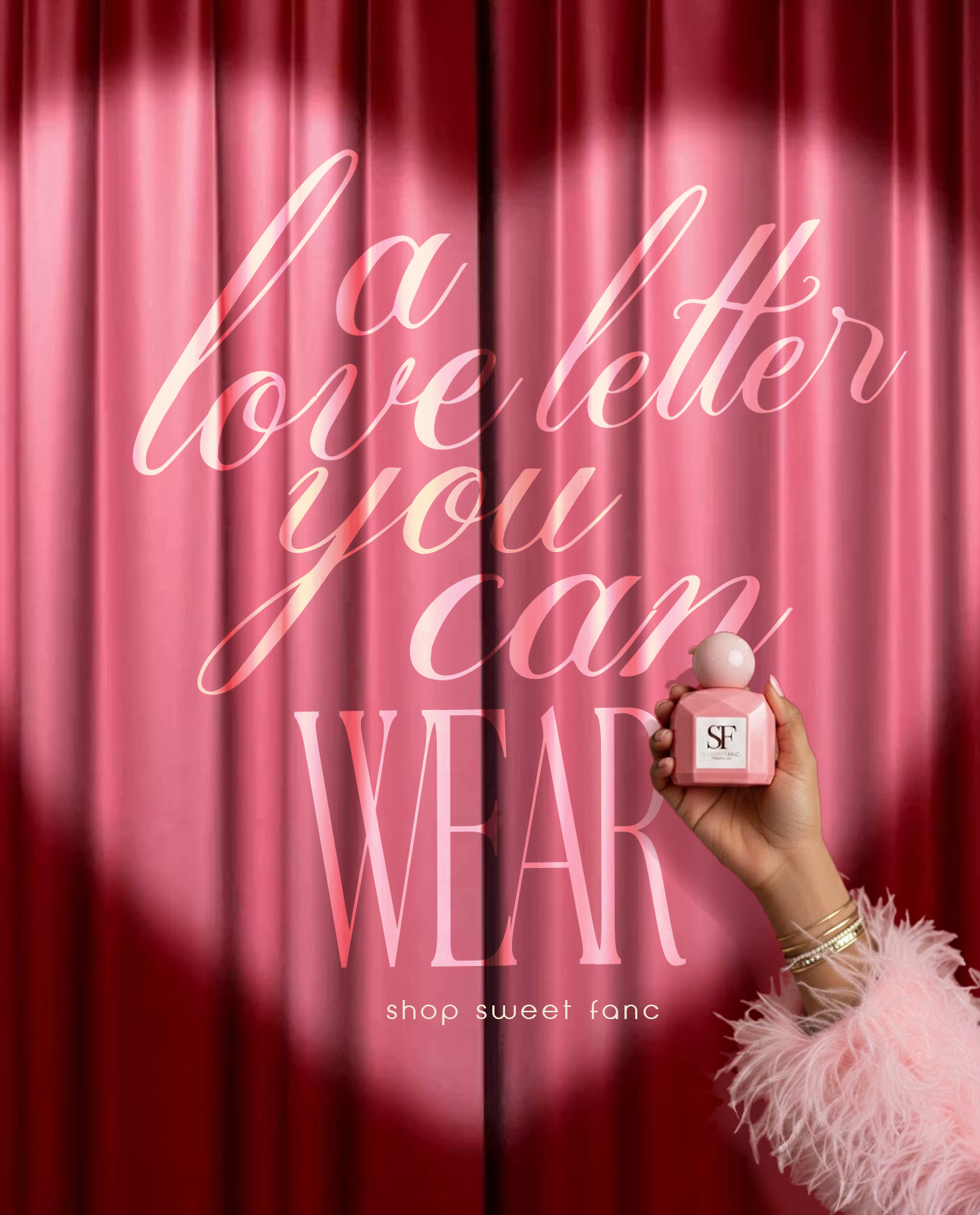 Valentine's Day Instagram post: Hand holding pink faceted perfume bottle before red curtain