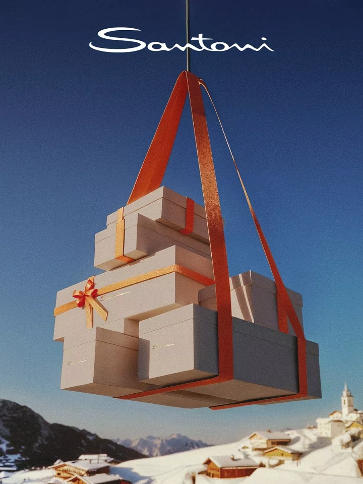Christmas creative ad: A stack of gift boxes slung in orange ribbon hanging from a cable