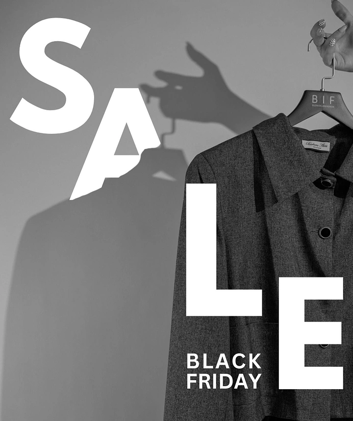 Black Friday creative ad: Hand holding a tweed jacket on a hanger with its shadow