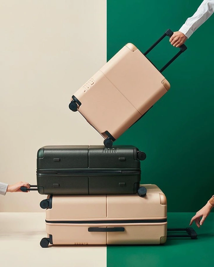 Luggage & Travel Bags creative ad: Graphic stacked luggage balancing composition