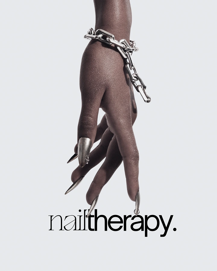 Nail Salons creative ad: Chained hand, chrome claws, striking editorial