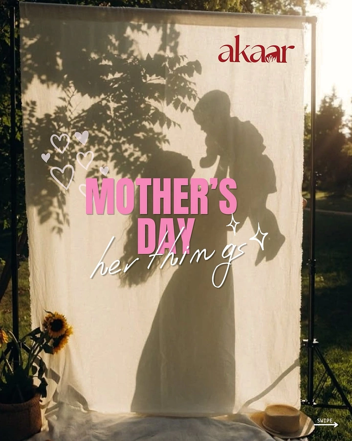 Mother's Day creative ad: Shadow of a mother lifting her baby on a sunlit cloth backdrop