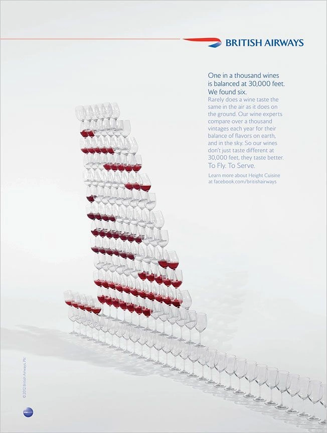 Creative ad: Stacked wine glasses forming an aircraft tail fin with the livery pattern in red wine