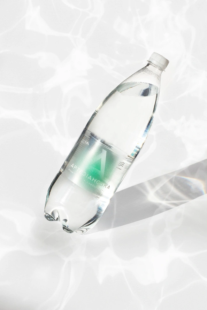 Packaged Drinking Water creative ad: Bottle floats through rippling water light
