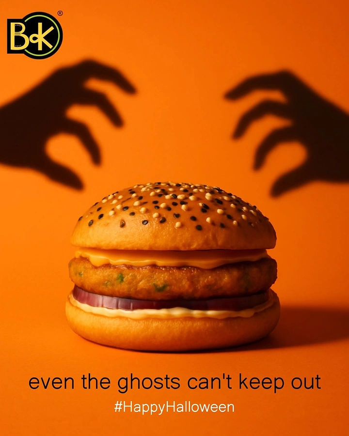 Halloween creative ad: Veg patty burger with looming shadow hands