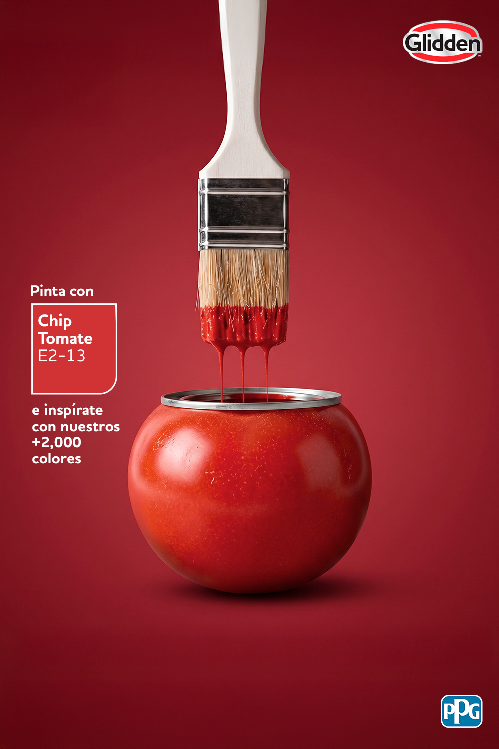 Paint brush dripping red paint into a tomato shaped like a paint can