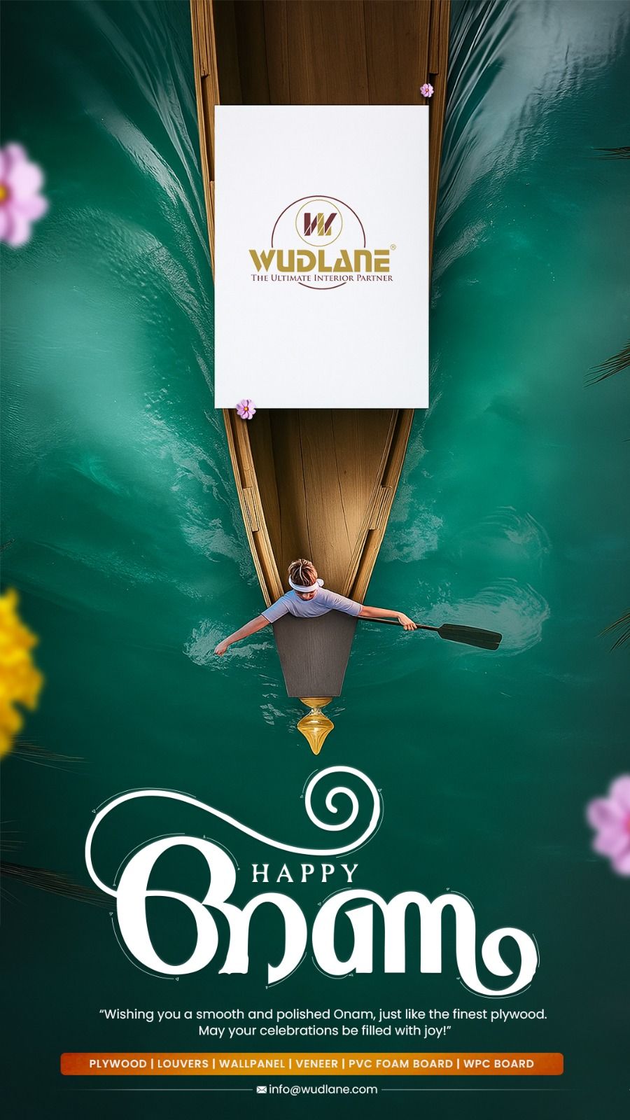 Aerial view of a rower in a long wooden boat on emerald water