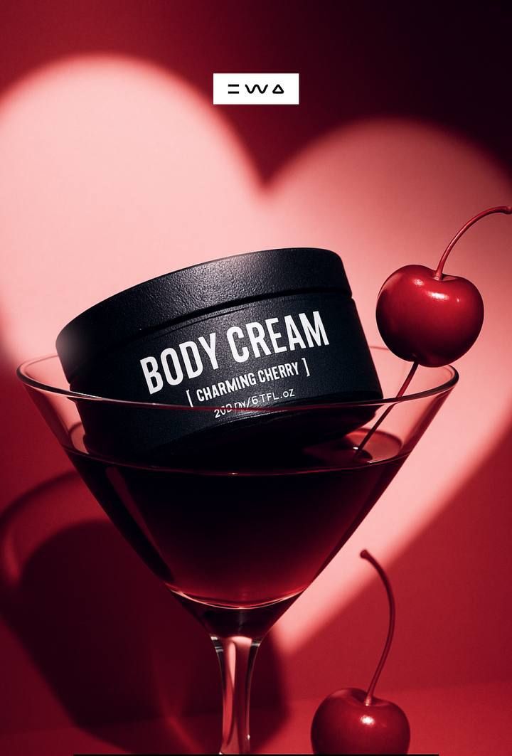Valentine's Day Instagram post: Black body cream jar tilted in a cherry-red martini glass