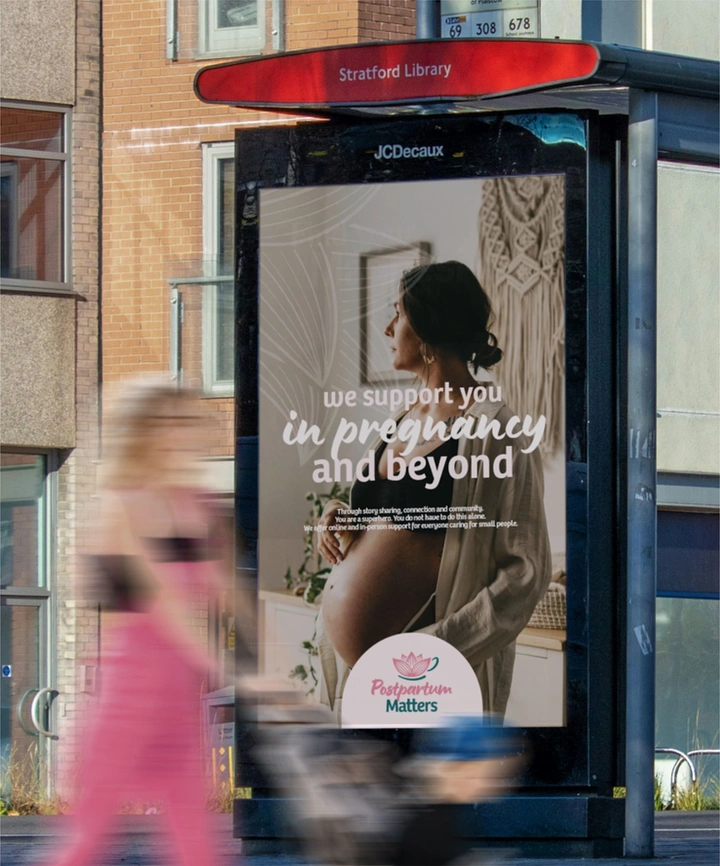 Maternity Hospitals & Gynaecologists creative ad: Transit shelter integrated into pregnancy message