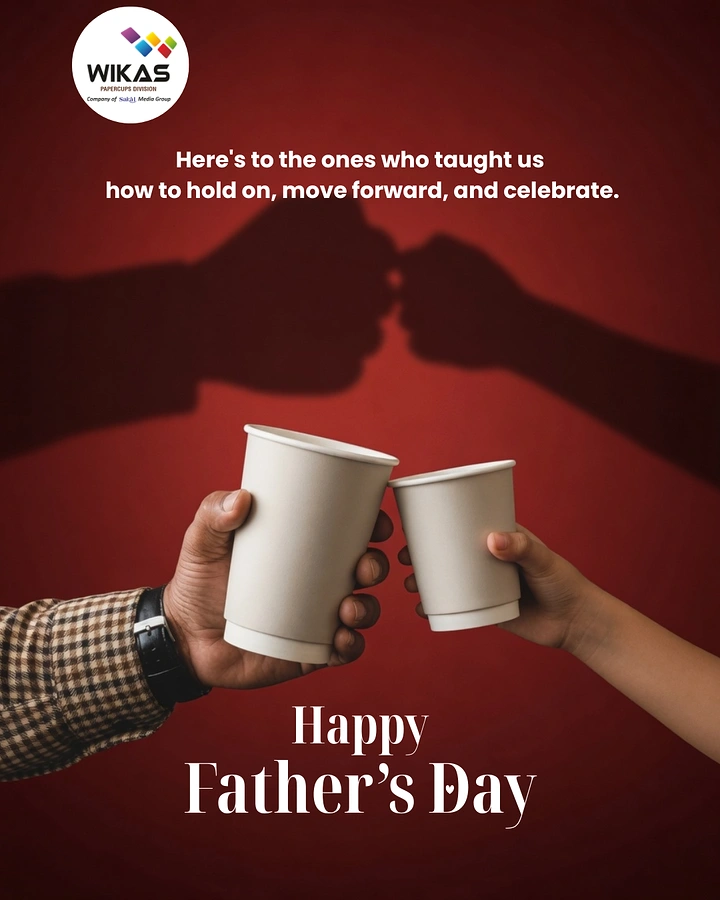 Father's Day creative ad: Father's and child's hands toasting with white paper cups, casting a fist-bump shadow