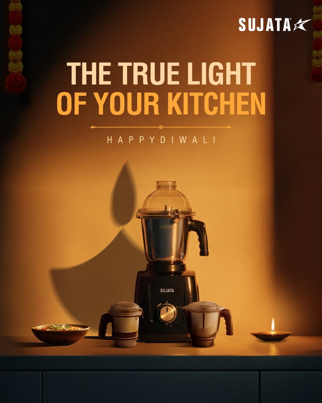Mixer grinder on kitchen counter casting a diya-shaped shadow