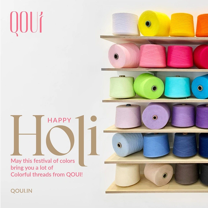 Holi creative ad: Rainbow yarn cones on wooden shelves