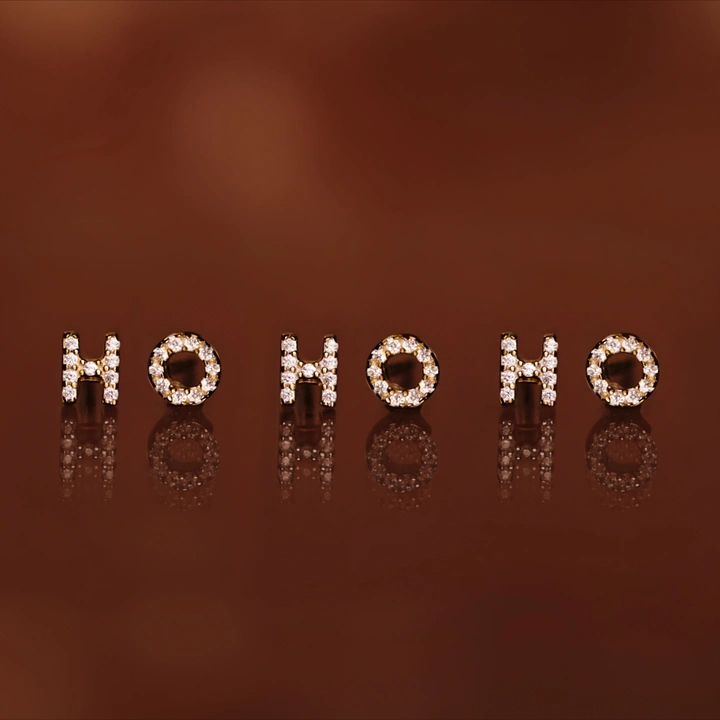 Christmas creative ad: Pavé diamond letter earrings spelling HO HO HO