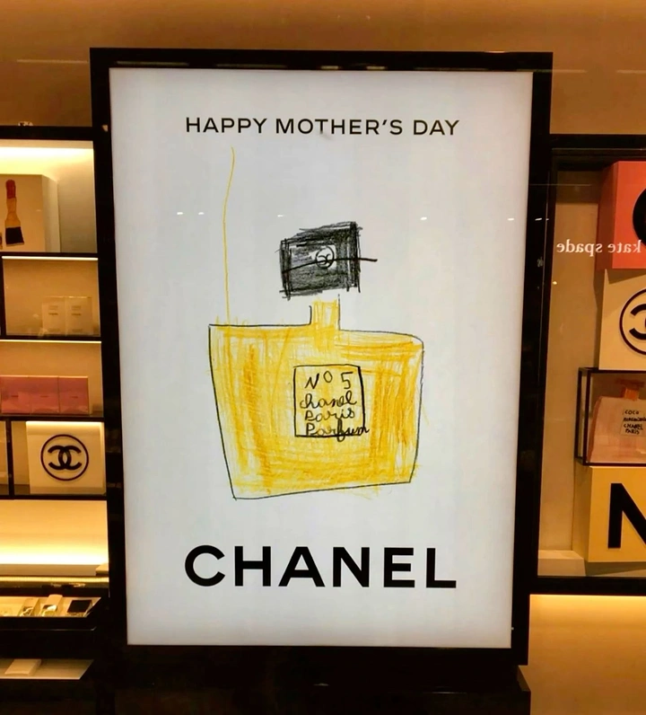 Mother's Day creative ad: Child-style crayon drawing of a yellow perfume bottle