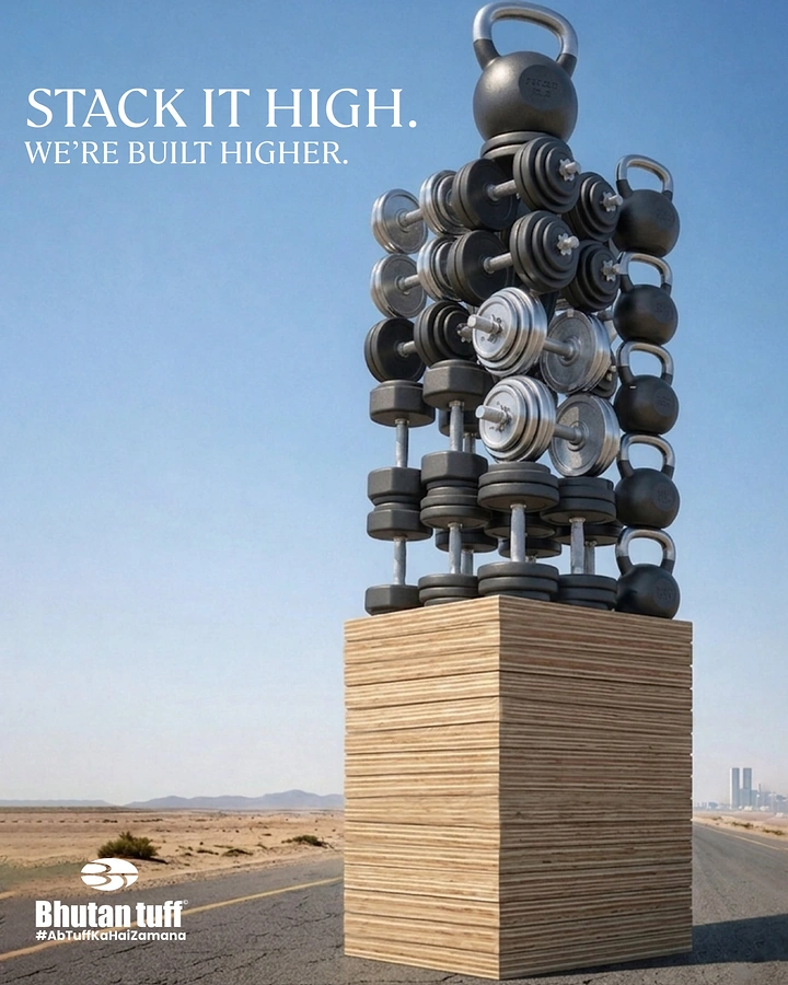 Fitness Equipment Stores creative ad: Towering dumbbell sculpture visual metaphor