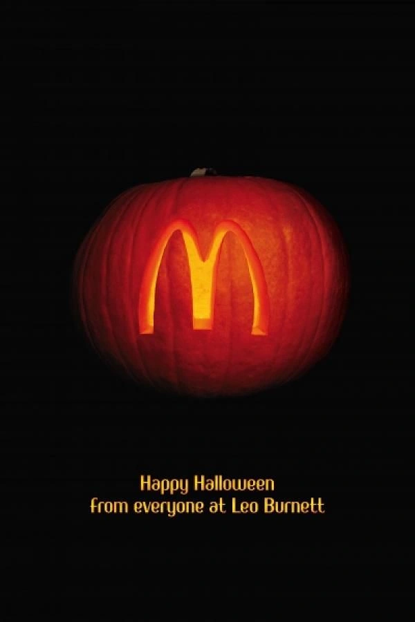 Halloween creative ad: Pumpkin carved with a glowing arches logo