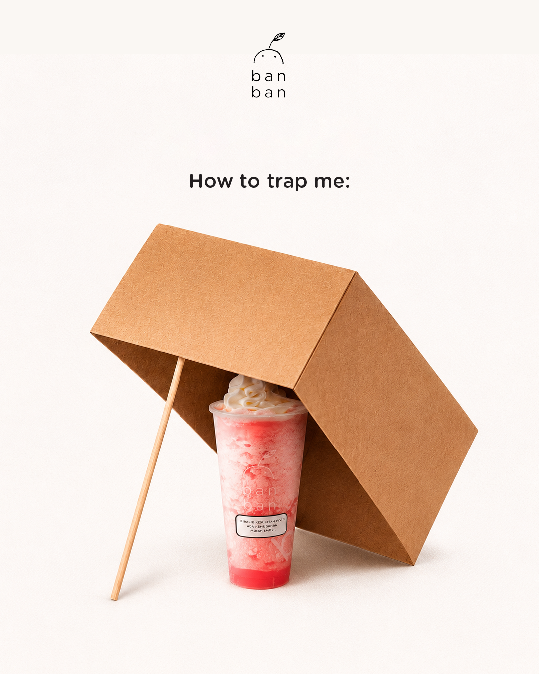Instagram post: Strawberry slush drink as bait under a propped cardboard-box trap