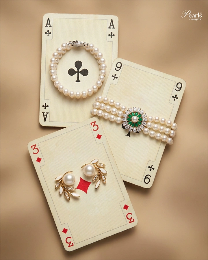 Jewellery creative ad: Pearl jewelry styled on vintage playing cards