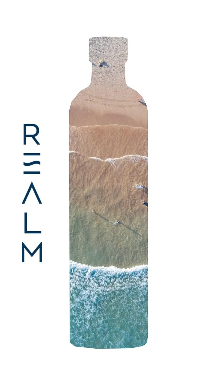 Packaged Drinking Water creative ad: Landscape revealed inside the bottle