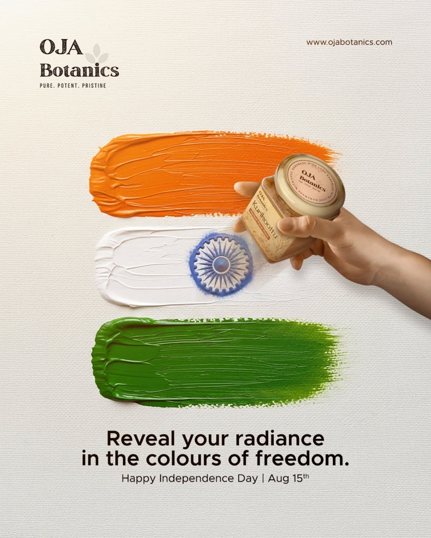Hand sprinkling herbal powder from a jar to form the Ashoka Chakra on tricolour paint swatches