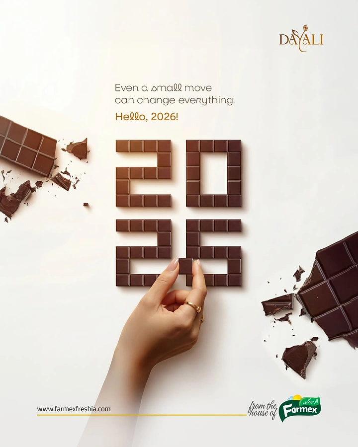 New Year creative ad: Chocolate squares arranged as the year 2026, with a hand placing the last piece