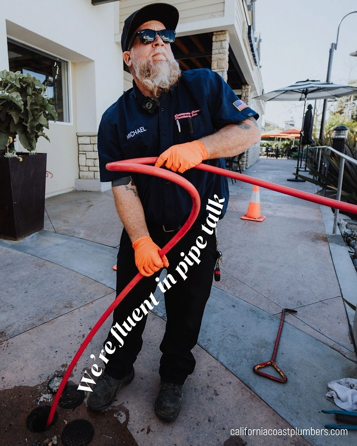 Plumbers creative ad: 'Fluent in pipe talk' copy along hose