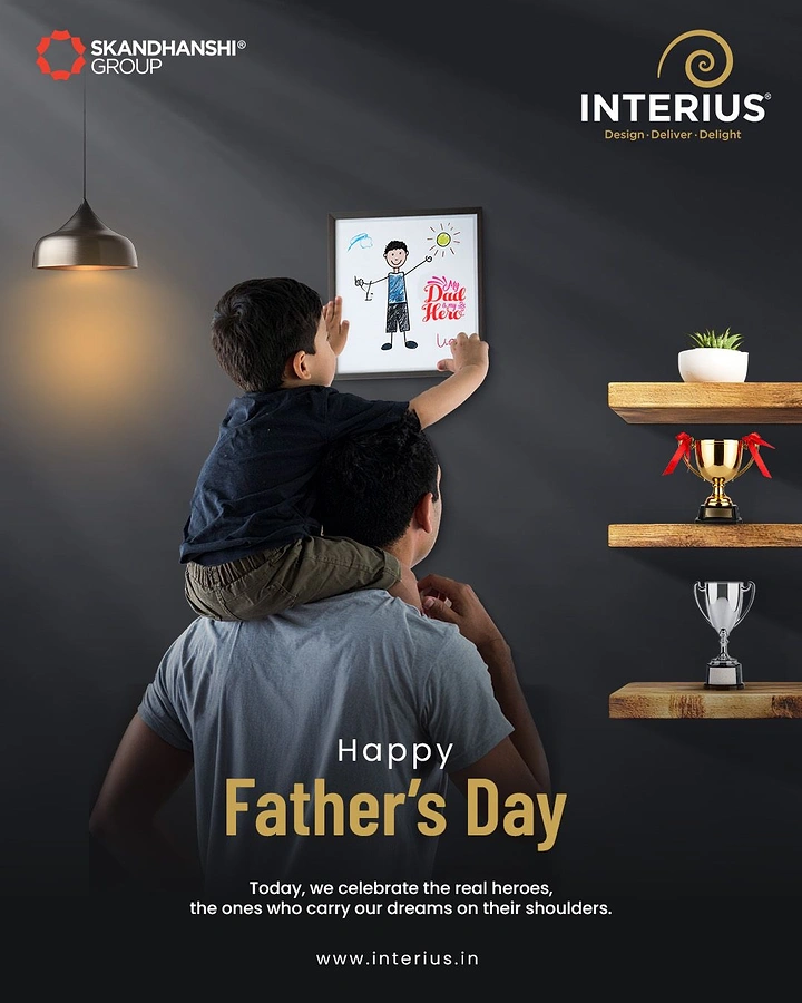 Father's Day creative ad: Child on father's shoulders hanging a 'My Dad is my Hero' drawing