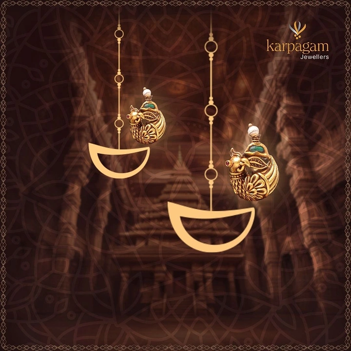 Diwali creative ad: Antique gold peacock earrings paired with hanging flat-gold diya shapes before a temple