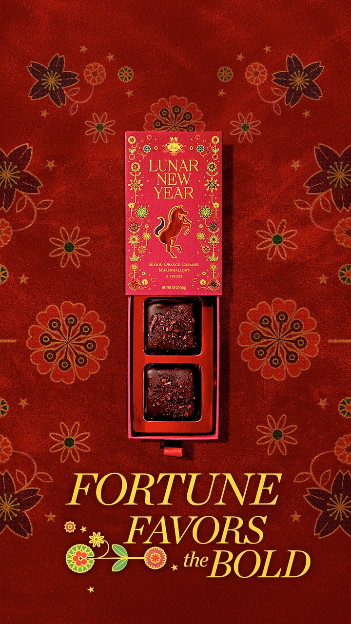 Lunar New Year creative ad: Open drawer gift box of two chocolate-coated marshmallows, top-down