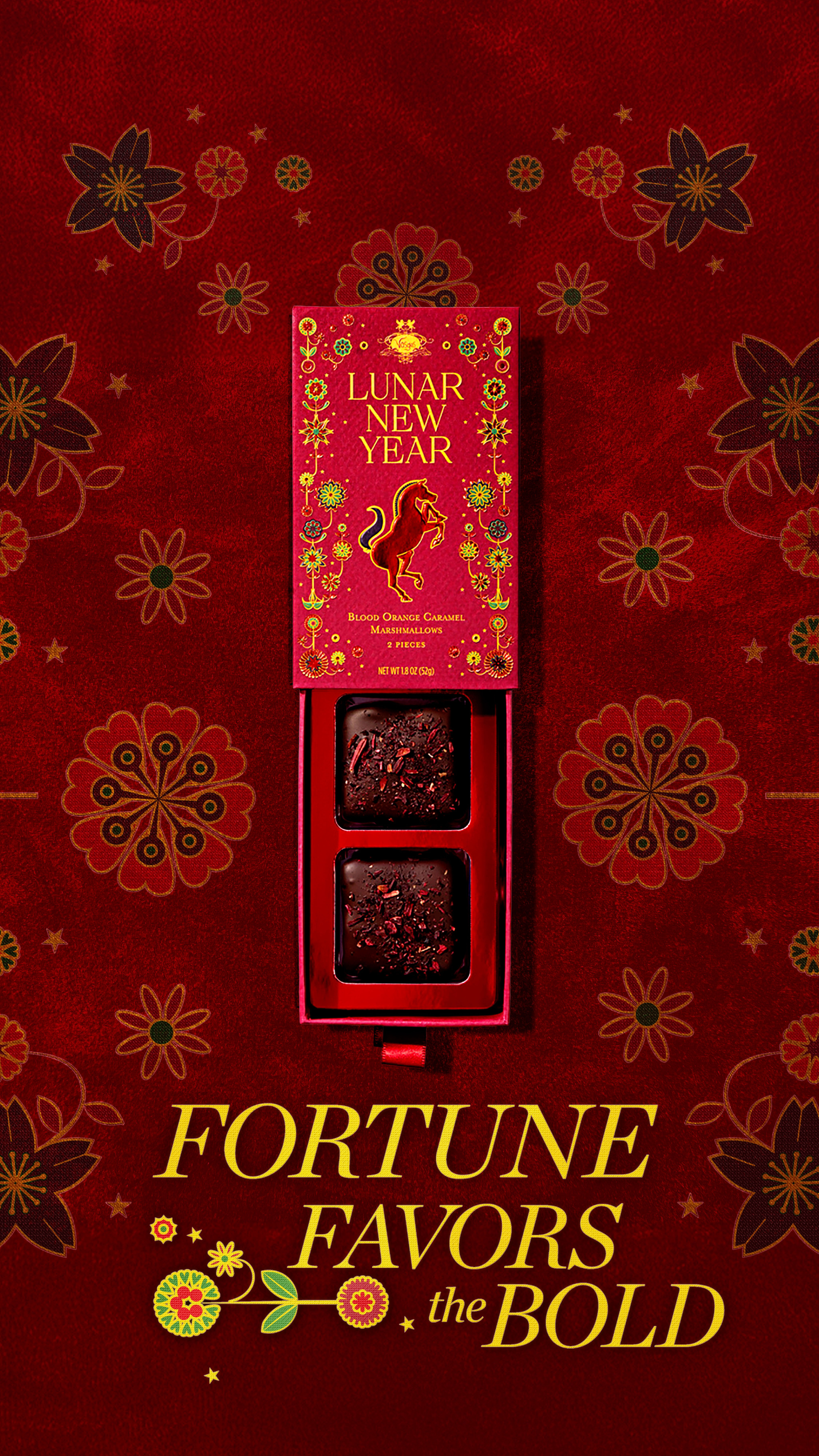 Lunar New Year Story: Open drawer gift box of two chocolate-coated marshmallows, top-down