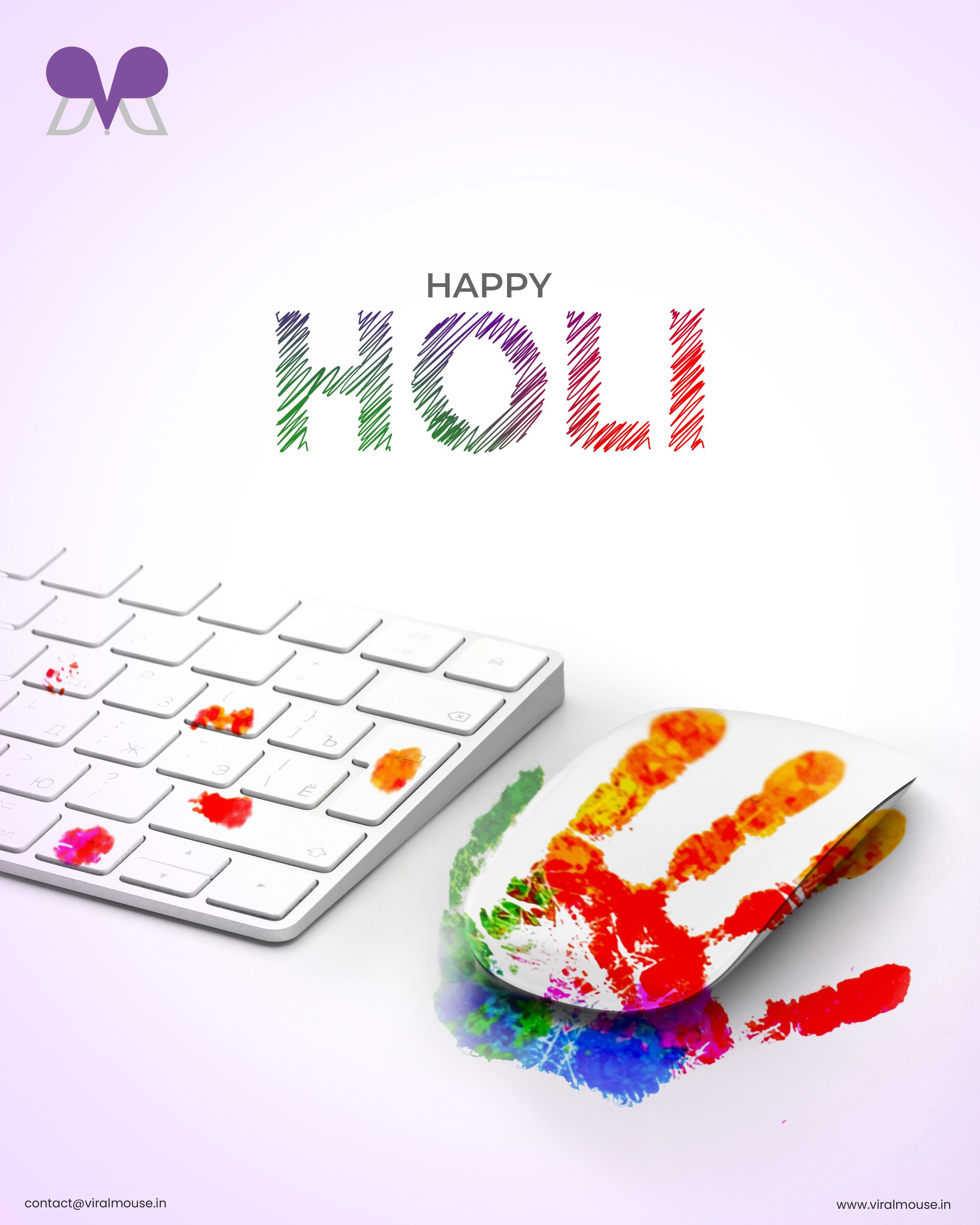 White keyboard and mouse stained with Holi colours