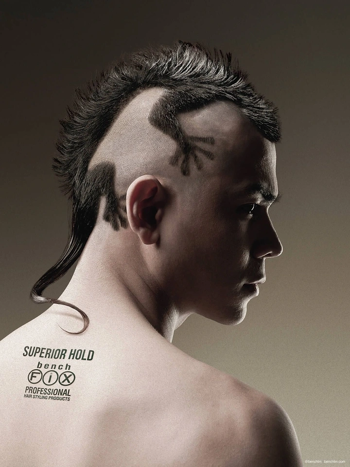 Beauty & Salon creative ad: Young man in profile with a gecko-shaped mohawk haircut