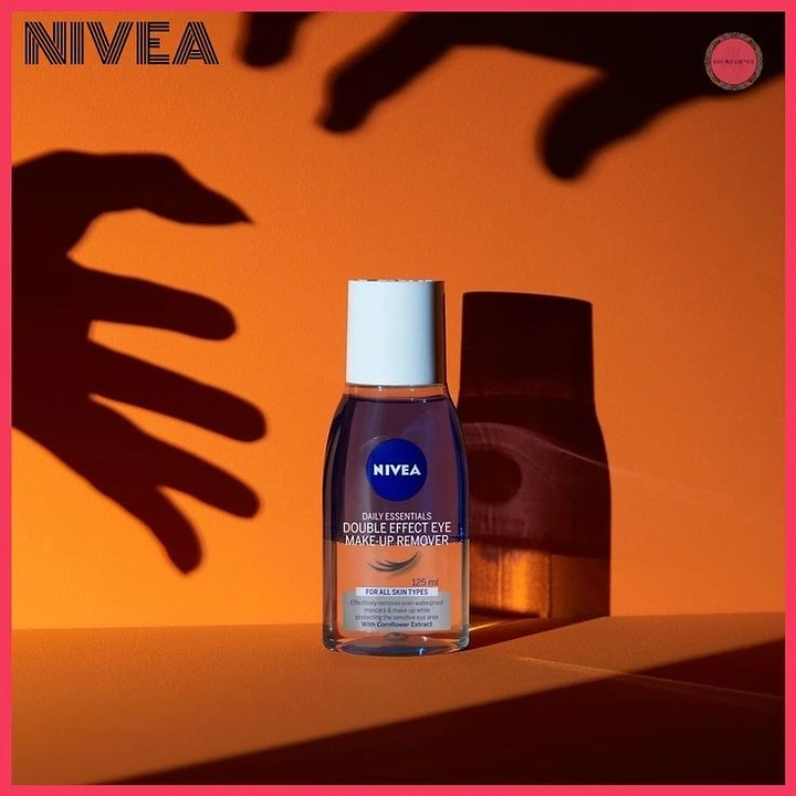 Halloween creative ad: Makeup remover bottle with creepy shadow hands