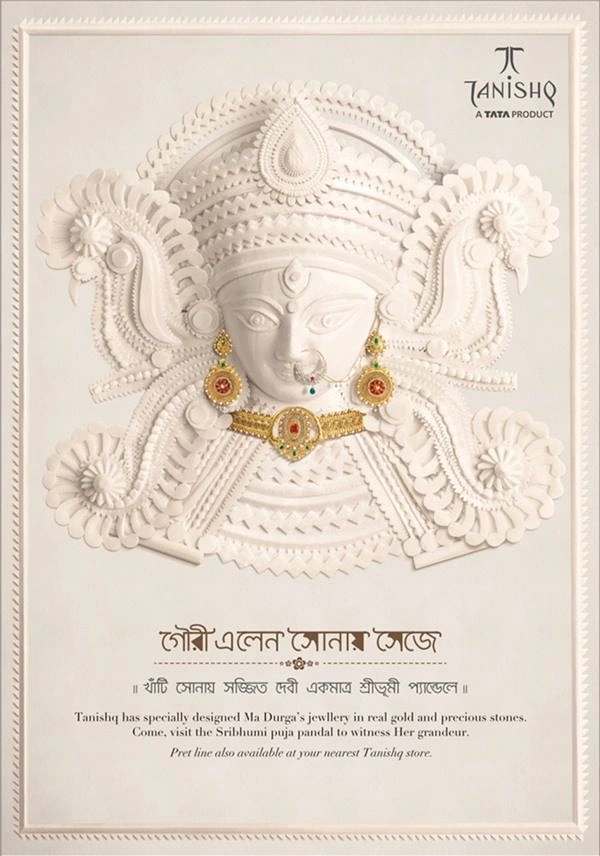 Durga Puja creative ad: White sholapith-style Durga face adorned with real gold jewellery