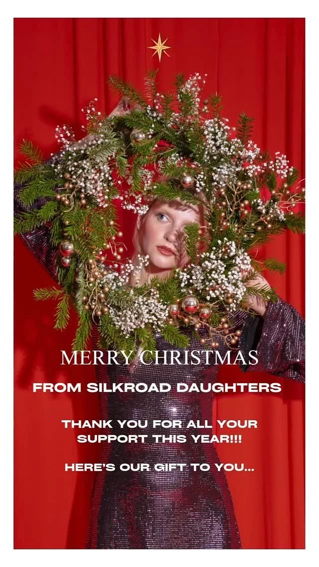 Christmas creative ad: Model in sequin dress holding a pine wreath framing her face