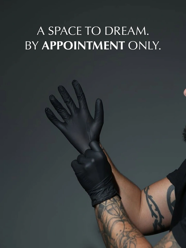 Tattoo Studios creative ad: Gloving-up gesture, moody appointment-only copy
