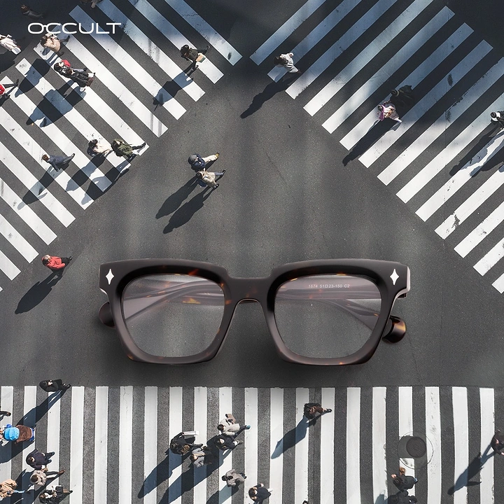 Opticians & Eye Care creative ad: Giant tortoiseshell eyeglasses lying on an aerial city crosswalk intersection